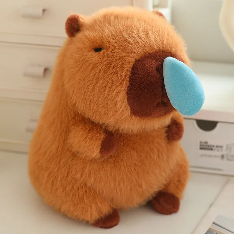 Kawaii plush toy resembling a beaver with a blue sponge on its nose, sitting on a surface.