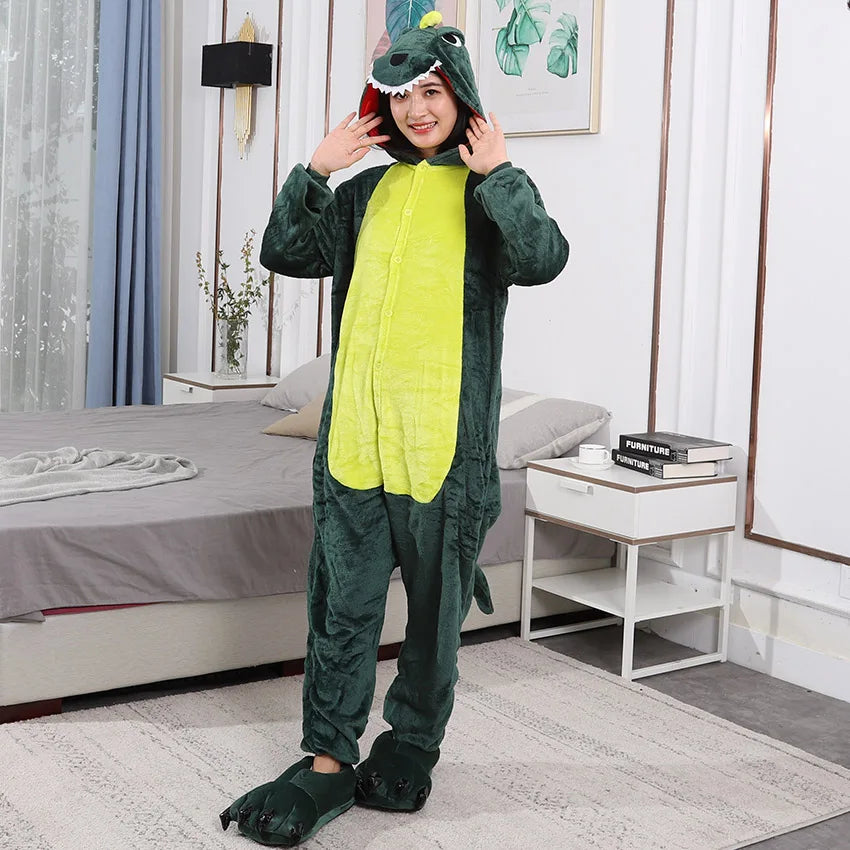 Person wearing a green kawaii dinosaur onesie in a bedroom setting