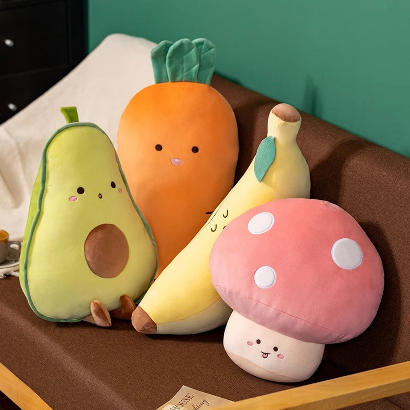 Set of kawaii plush toys shaped like an avocado, carrot, banana, and mushroom on a brown surface.