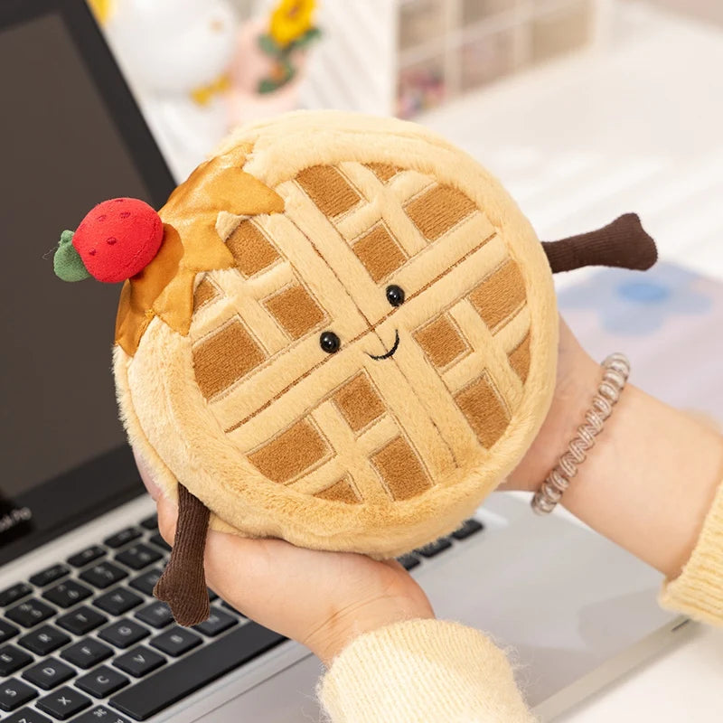 Plush waffle kawaii toy held in a hand with a blurred background