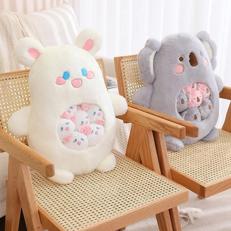 Two kawaii plush toys, one white and one gray, sitting on wicker chairs.