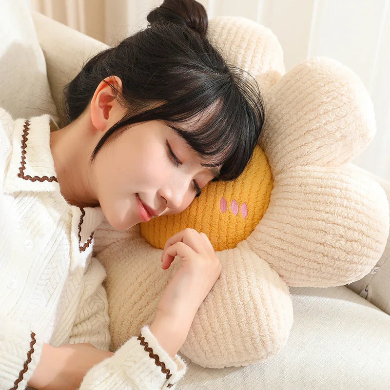 Woman lying on a large flower-shaped kawaii pillow with a soft texture