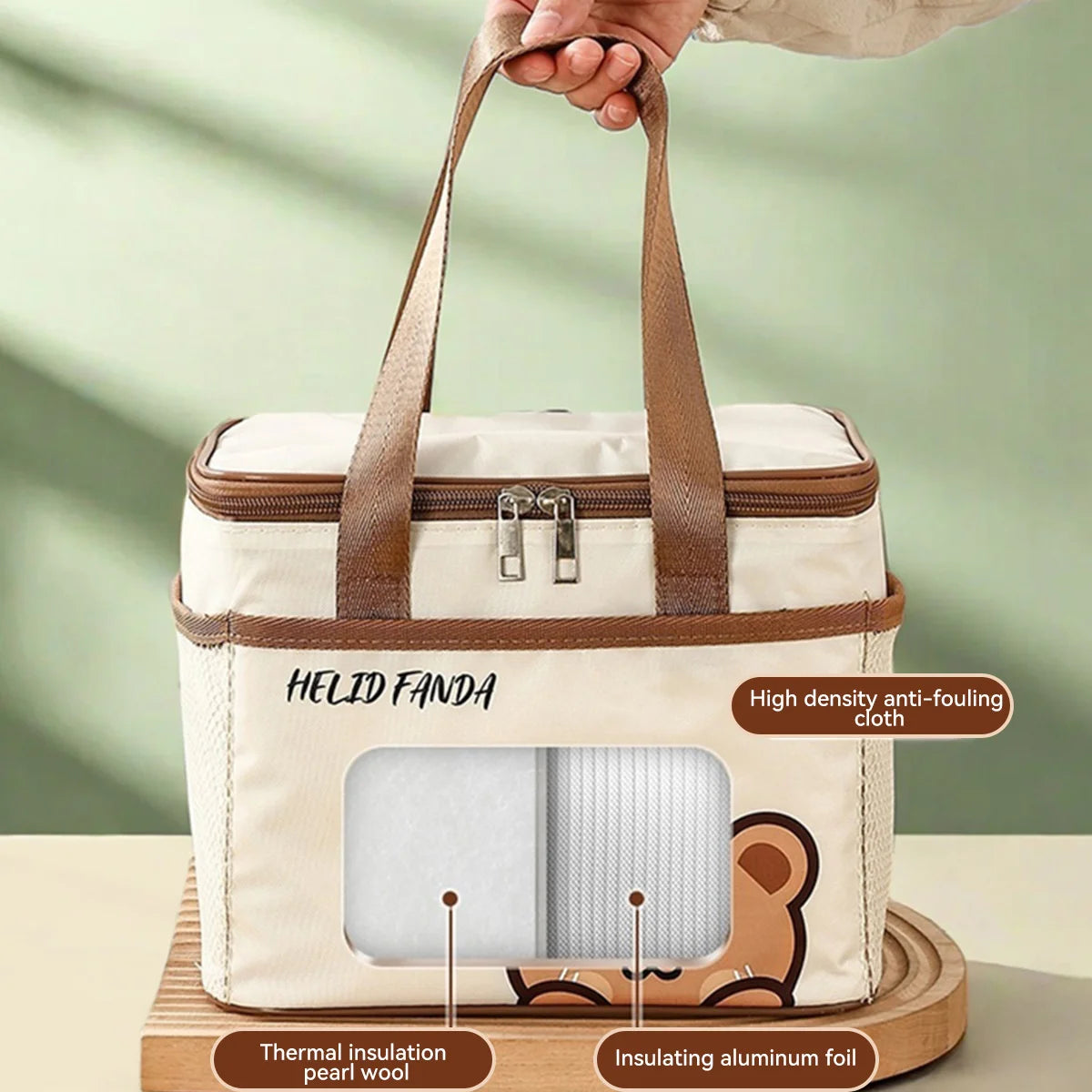 White cooler bag with brown handles held by a hand, featuring kawaii-style branding and product features.