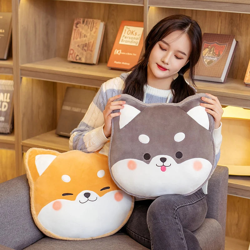 Woman holding two cute animal-shaped kawaii cushions in a cozy room.