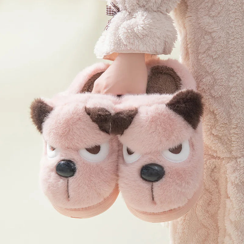 Pink kawaii bear slippers worn by a person with a soft, blurred background