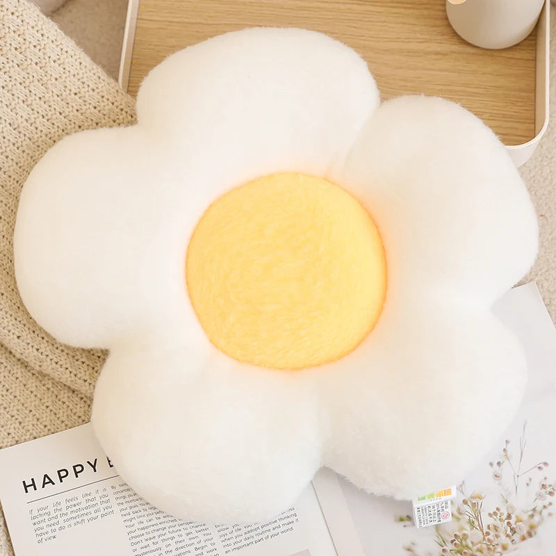 Fluffy white cloud-shaped kawaii cushion with a glowing yellow center on a wooden surface.