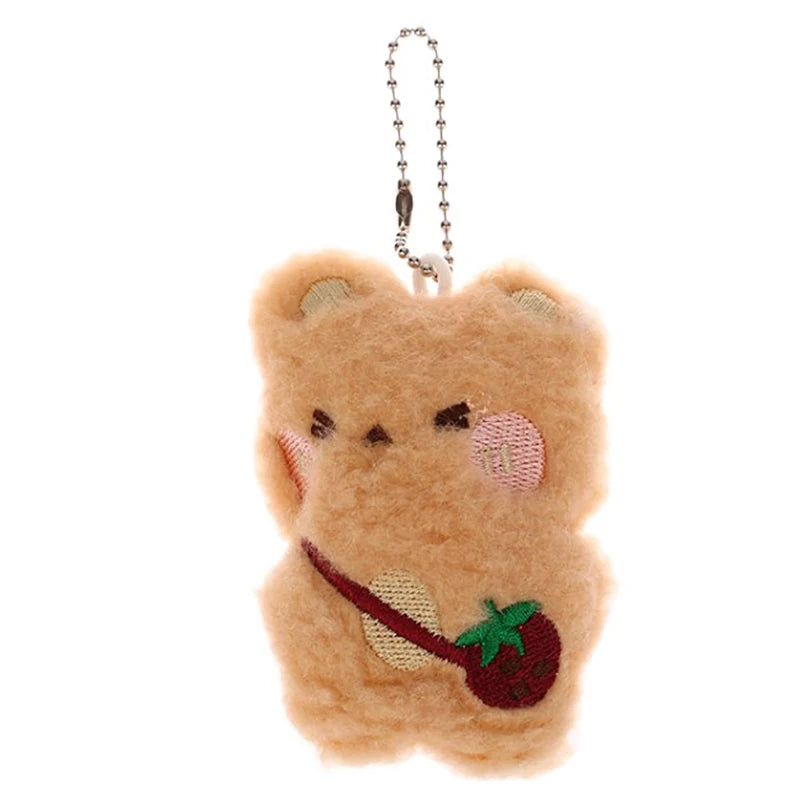 Plush bear keychain with a kawaii cherry on a white background