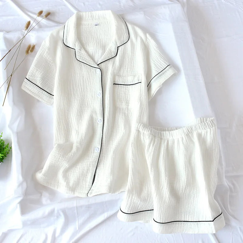 White pajama kawaii set with black piping on a white background