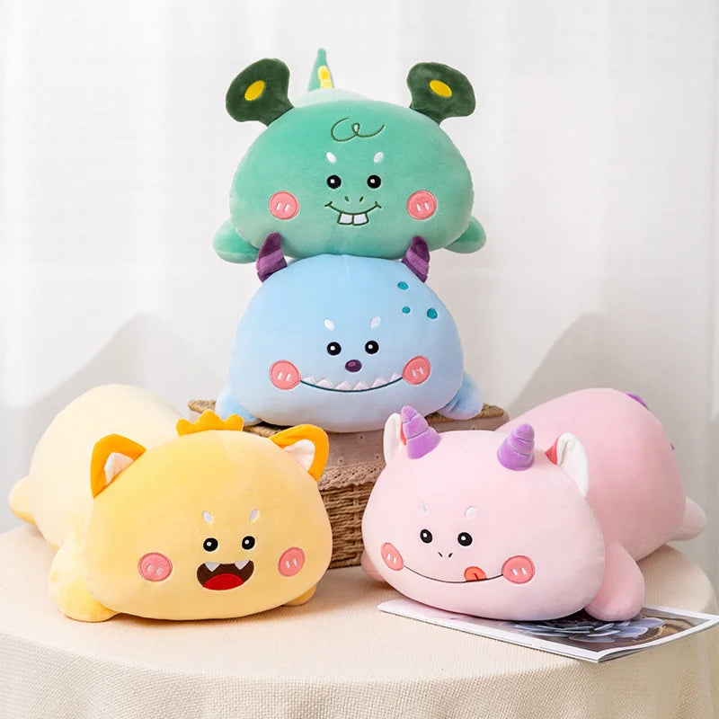 Four colorful kawaii plush toys stacked on a white surface