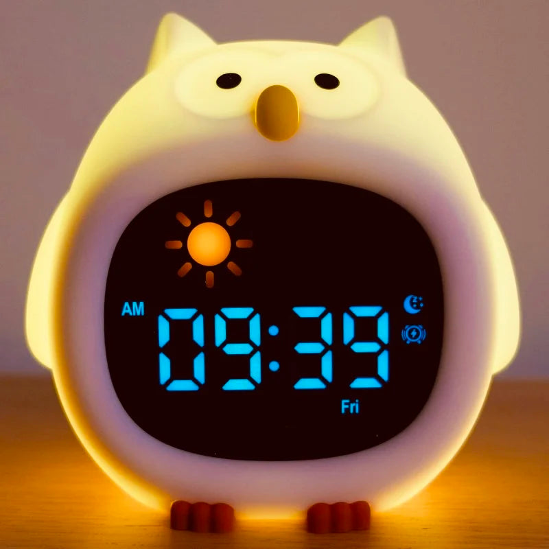 Owl-shaped Kawaii digital clock with a glowing body on a wooden surface