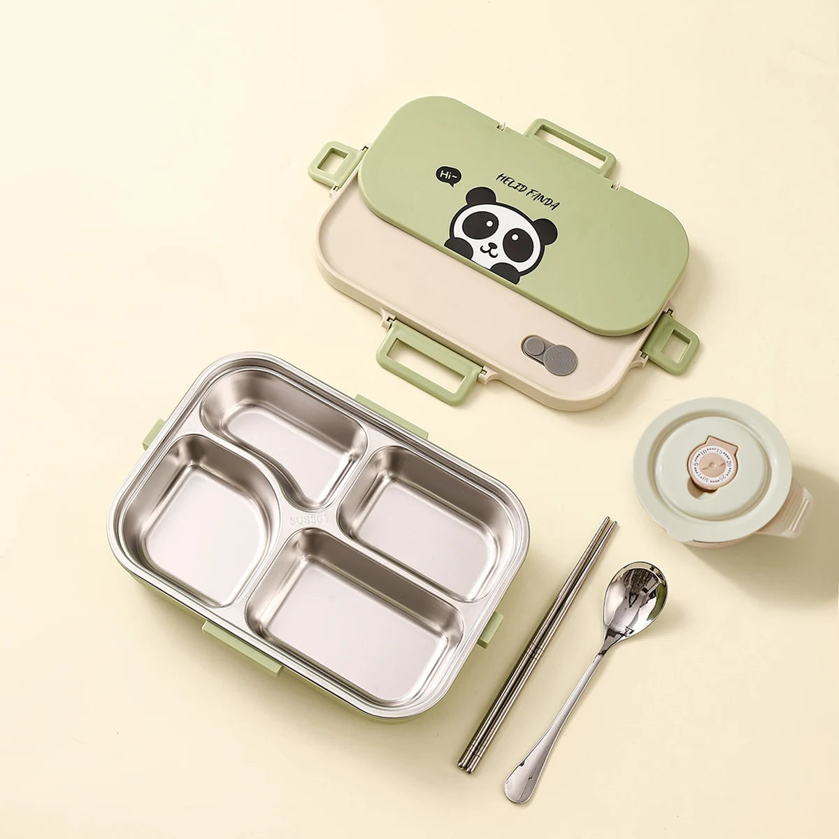 Kawaii bento box with kawaii panda design, divided tray, spoon, and straw on a light background