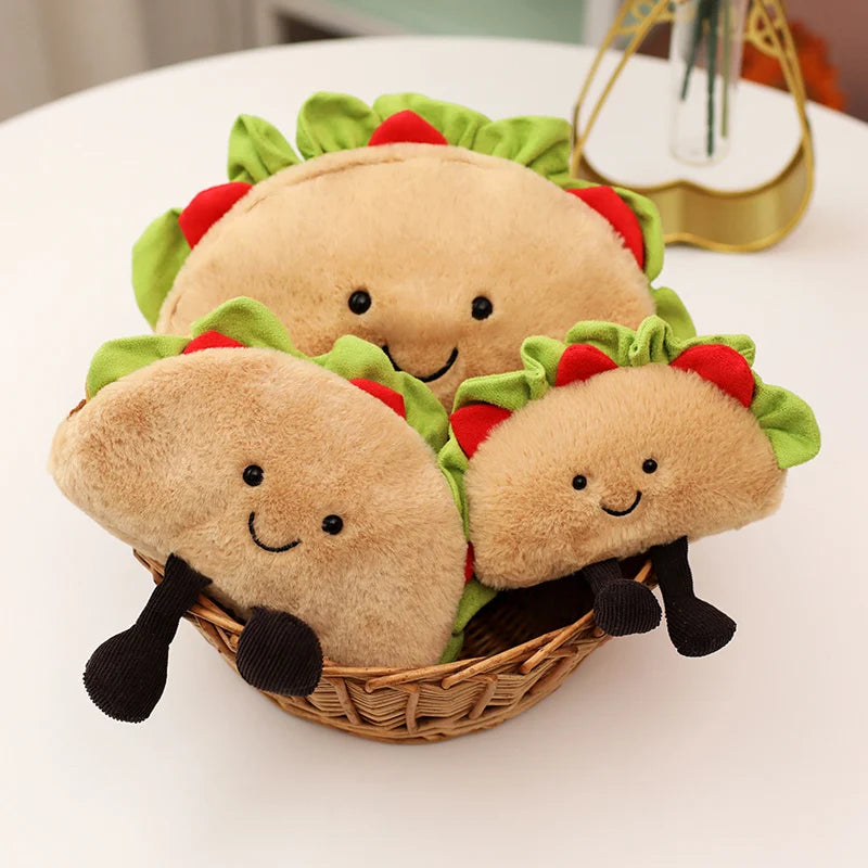 Plush kawaii toys shaped like tacos in a basket on a white surface