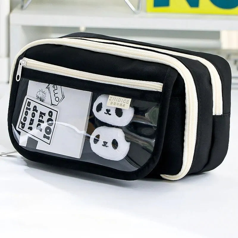 Black and white kawaii toiletry bag with clear front panel on a white background