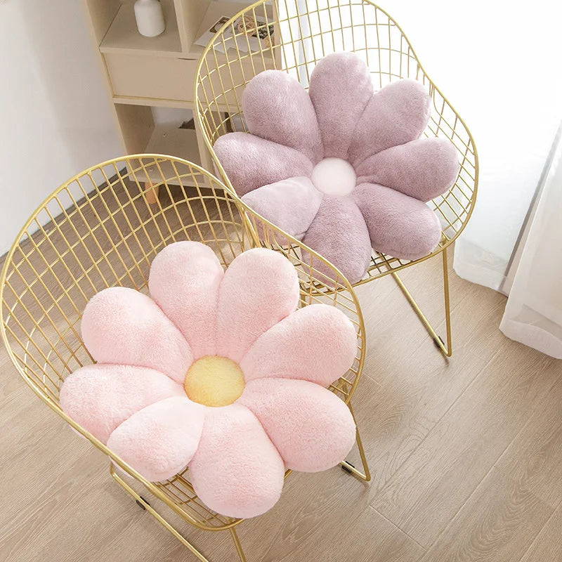 Two Kawaii flower-shaped cushions on gold wire chairs in a room.