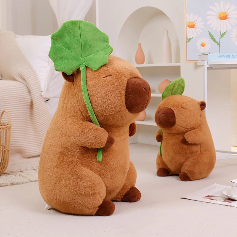 Two brown kawaii plush toys with green leaves on a light-colored floor.