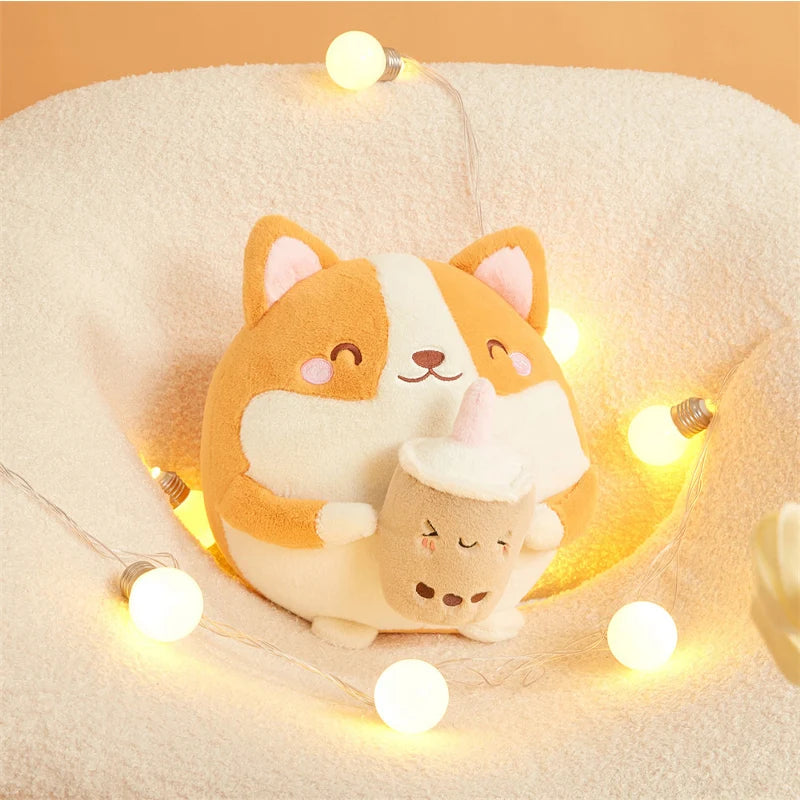 Plush corgi kawaii toy with a small cat plushie inside, surrounded by string lights on a beige cushion.