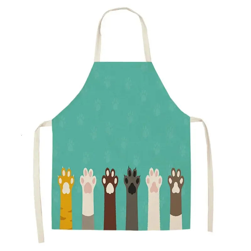 Teal Kawaii apron with colorful paw prints on a white background