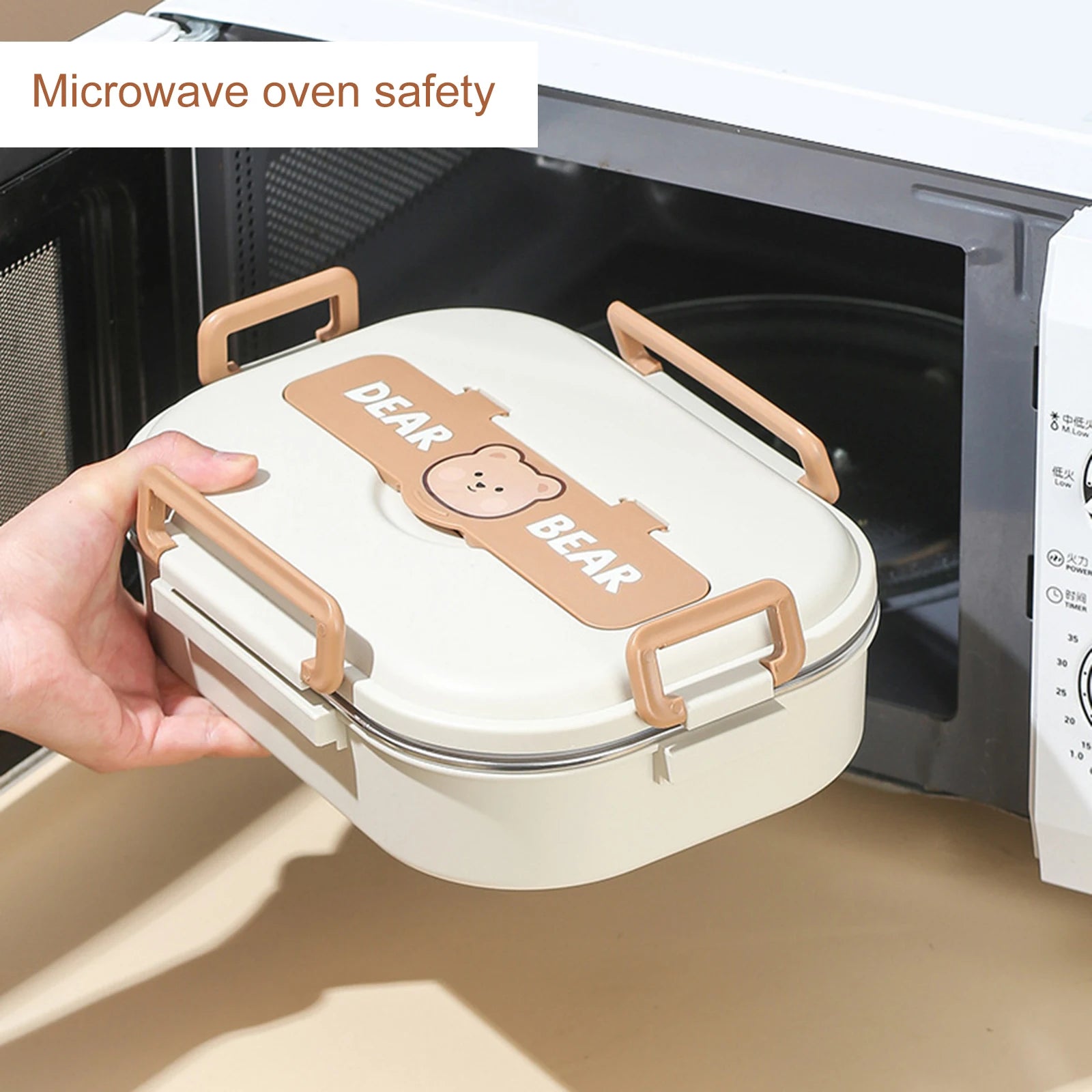 Person holding a kawaii cartoon bear-themed lunch box in front of an open microwave