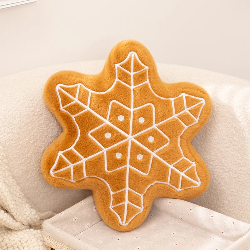Star-shaped gingerbread cookie kawaii pillow with white icing on a beige background
