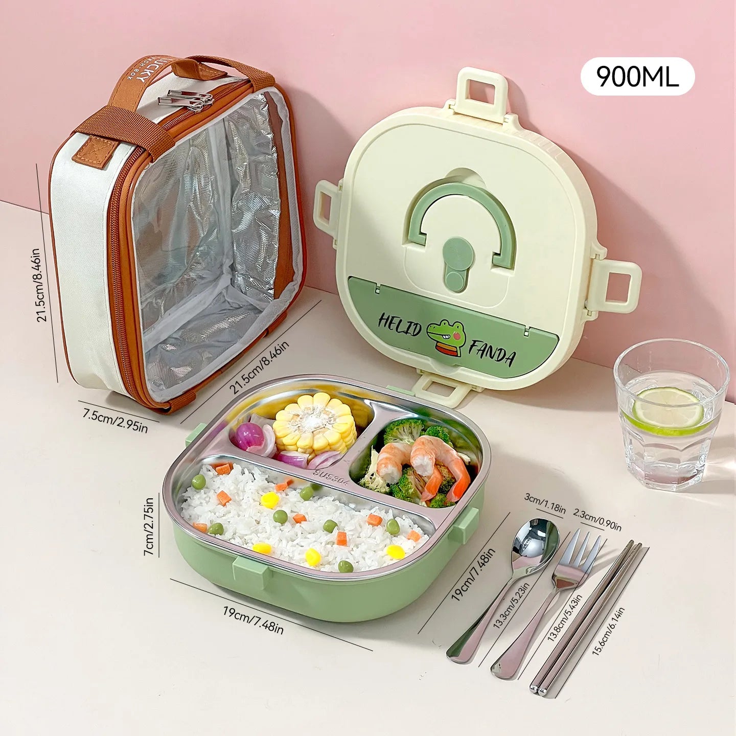 Green kawaii lunch box with compartments, fork, spoon, and glass of water on a pink background