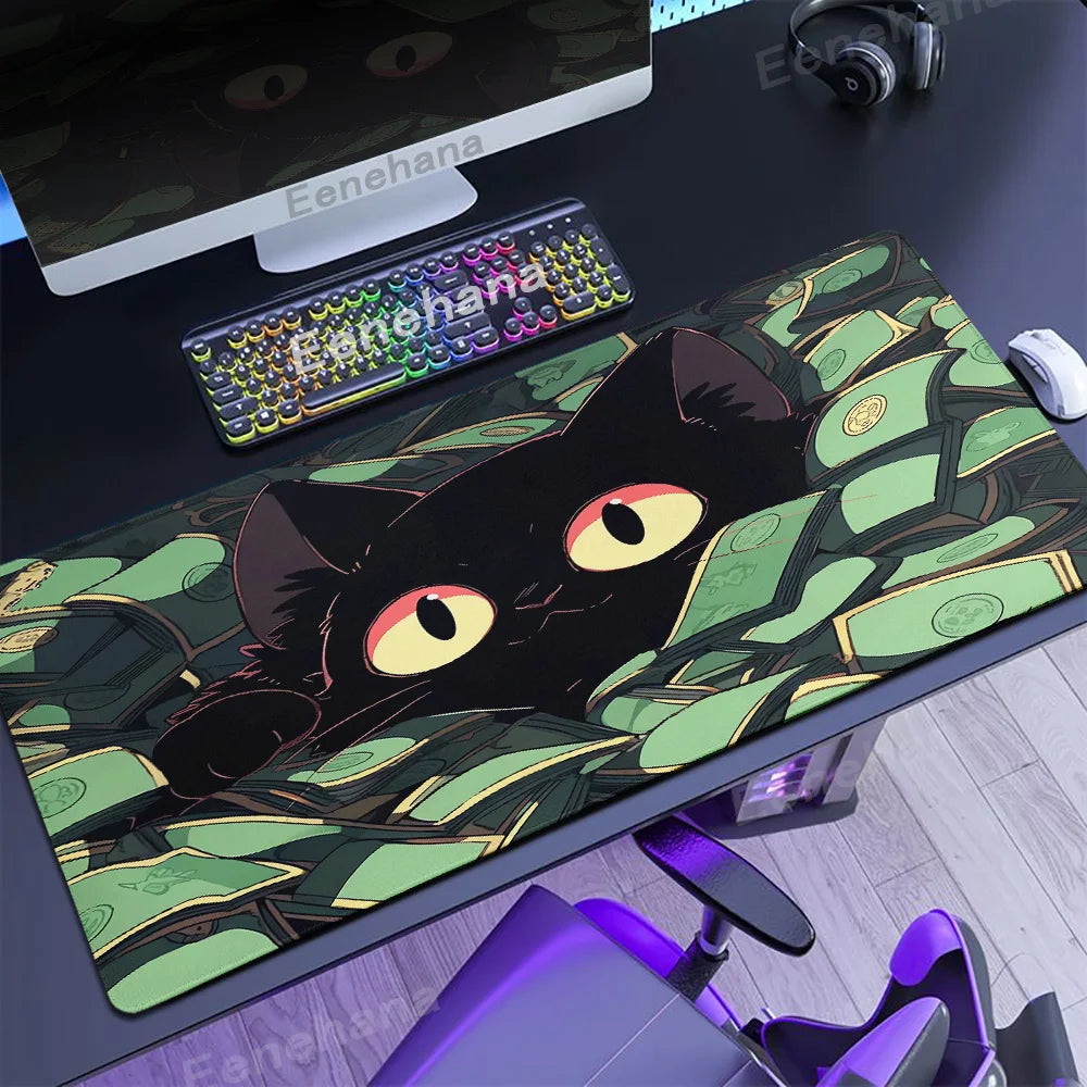 Desk setup with a large mouse pad featuring a Kawaii black cat design, keyboard, and monitor.
