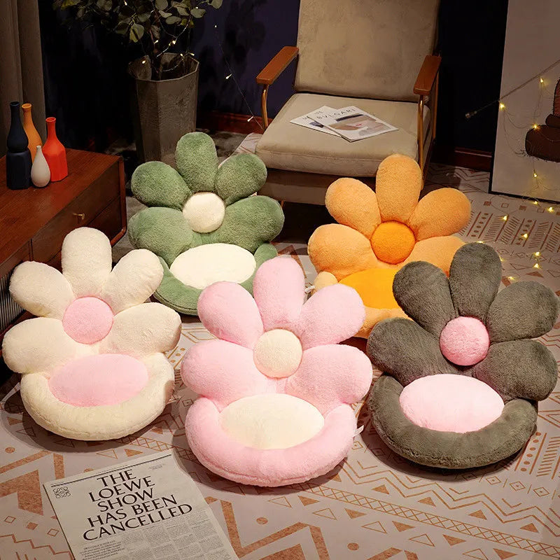 Flower-shaped kawaii cushions in various colors on a patterned floor.