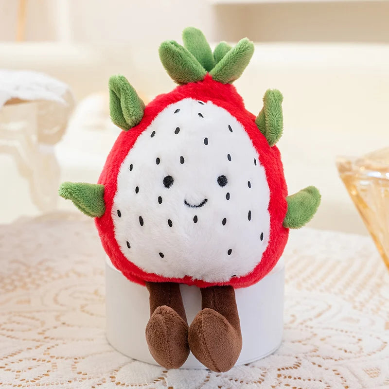 Plush kawaii toy shaped like a strawberry with a smiling face on a textured surface