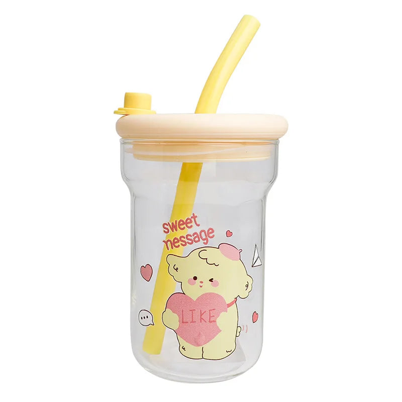 Clear tumbler with yellow lid and straw, featuring a Kawaii cartoon bear holding a heart and text on a white background.