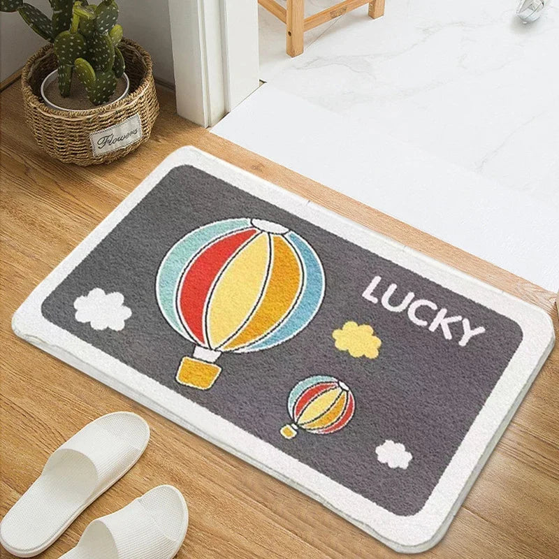 Decorative doormat with Kawaii hot air balloon design and 'LUCKY' text on a wooden floor.