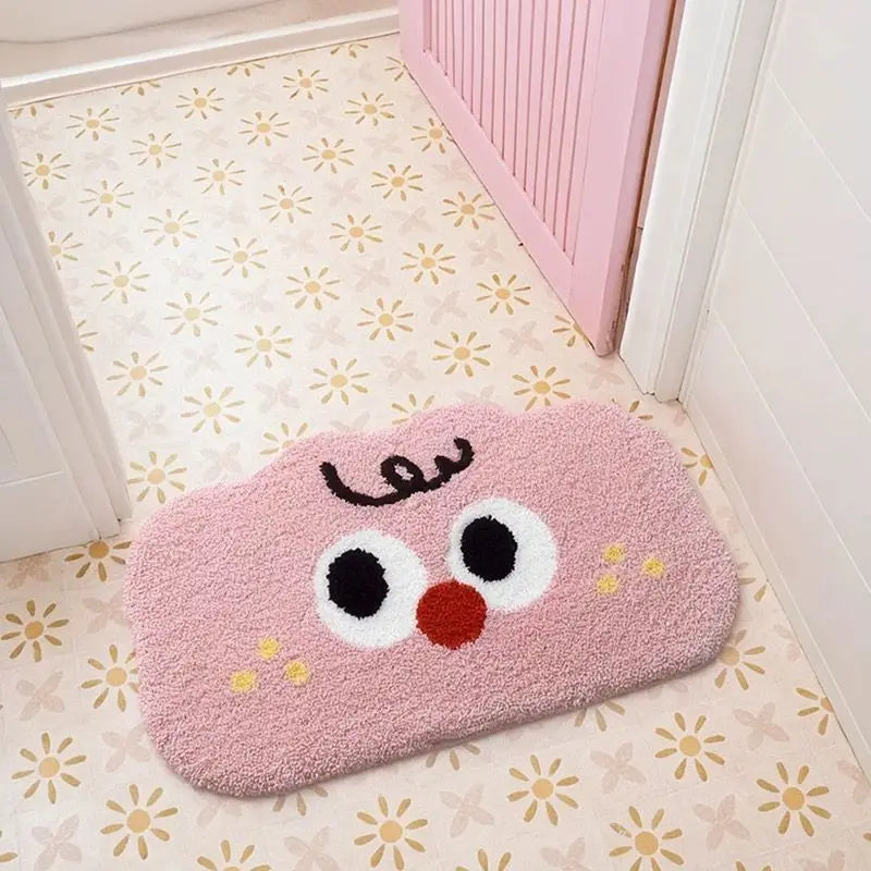 Pink Kawaii-style rug with eyes and a mouth on a floral-patterned floor.