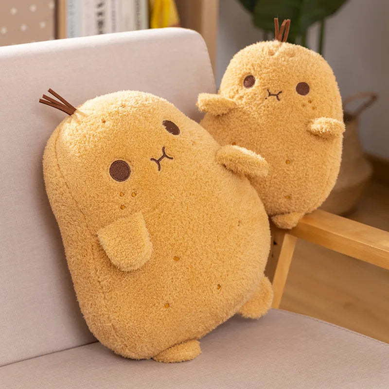Two yellow plush kawaii toys resembling pachirisu on a chair.