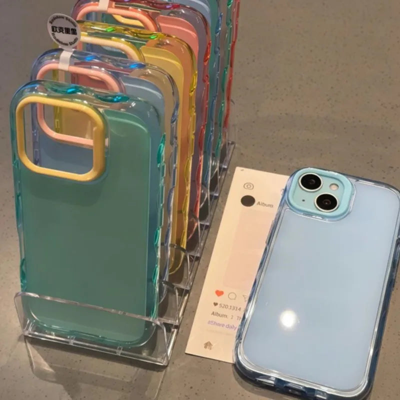 Kawaii phone cases displayed on a stand with a phone case on a surface.