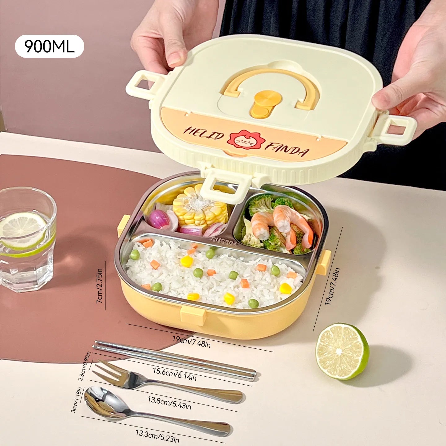 Kawaii bento box with compartments filled with food, surrounded by utensils and a glass of water on a pink surface.
