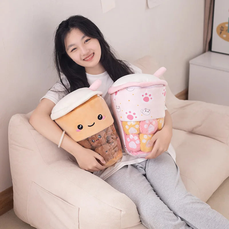 Woman holding two kawaii boba tea plush toys