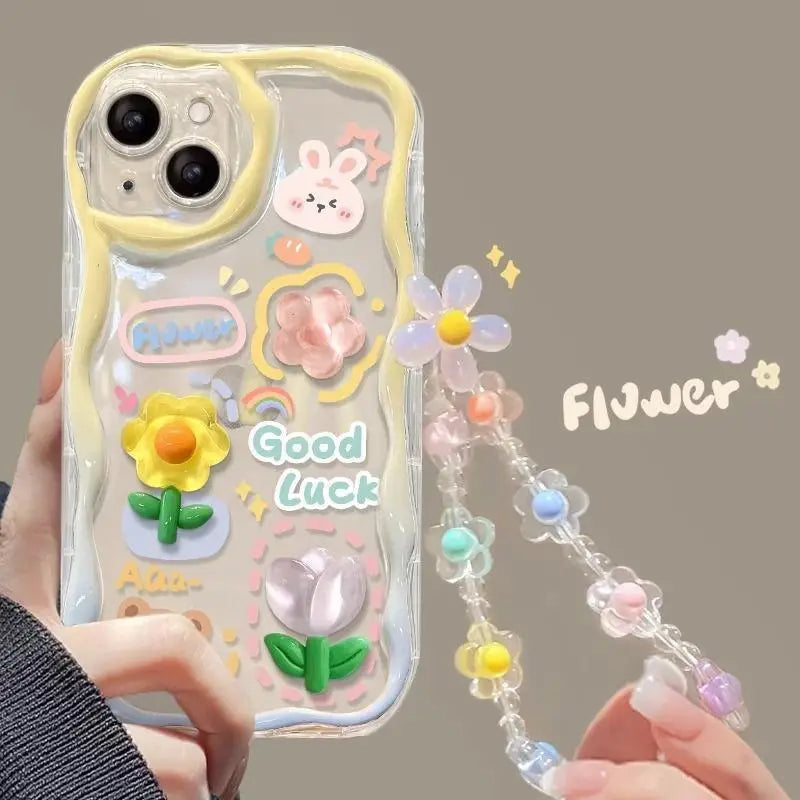 Phone case with kawaii floral design and decorative chain held by a hand