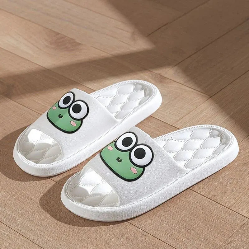 White slippers with cartoon frog kawaii design on a wooden floor