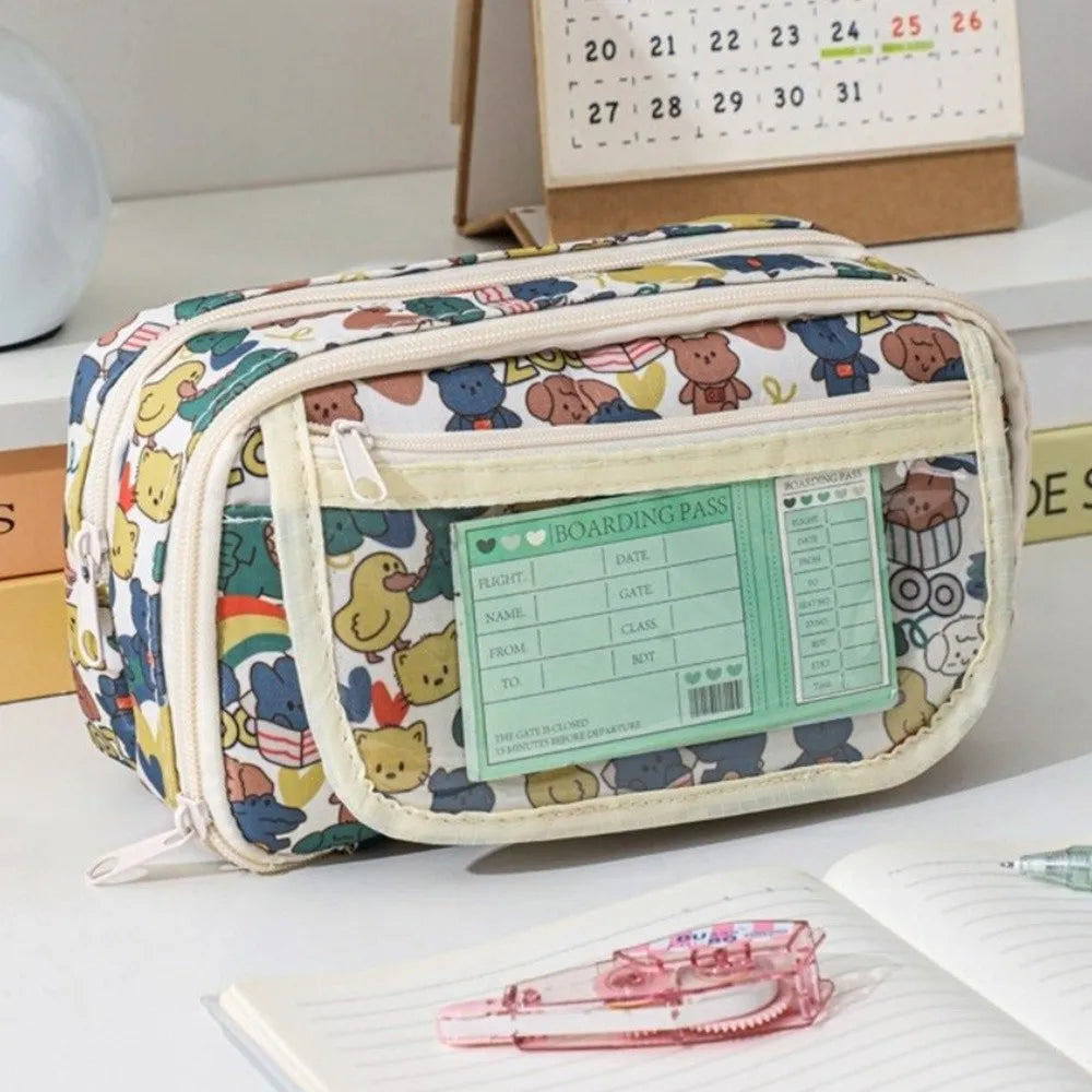 Colorful toiletry bag with kawaii cartoon designs on a desk with stationery items.