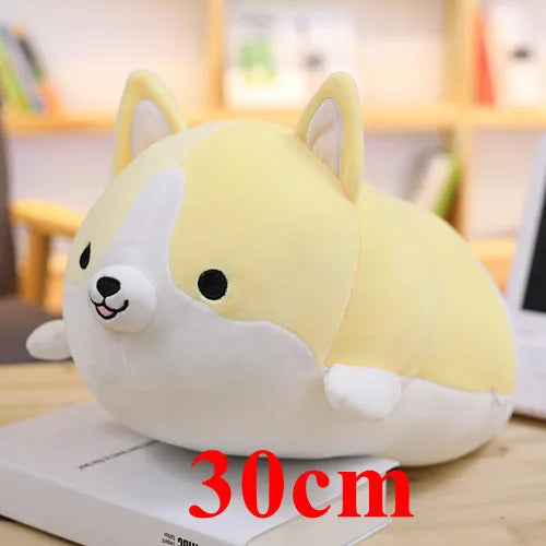 Plush kawaii toy shaped like a corgi with a yellow and white color scheme, sitting on a surface with a blurred background.
