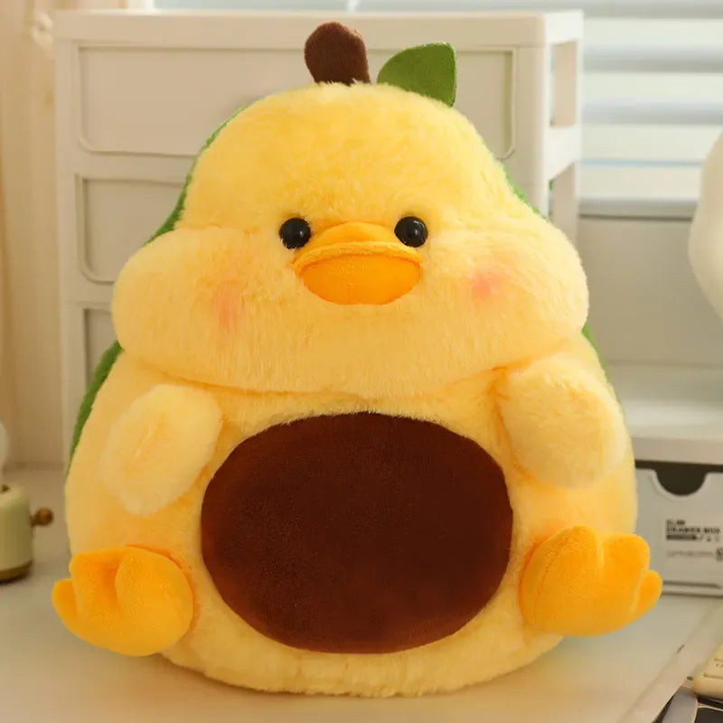 Kawaii plush toy shaped like a yellow chick with a brown body on a white surface.