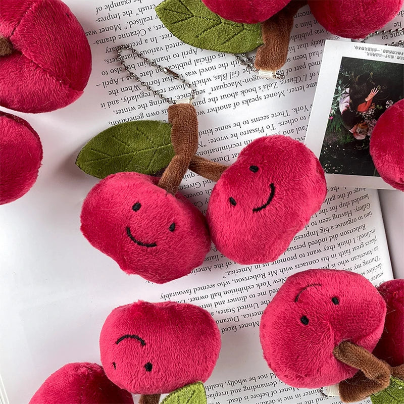 Plush kawaii cherry toys with smiling faces on a magazine page