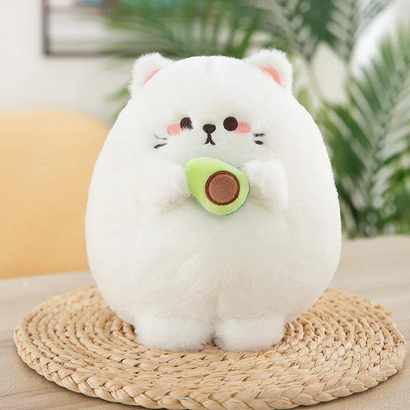 White kawaii plush toy resembling a cat with an avocado on a woven mat