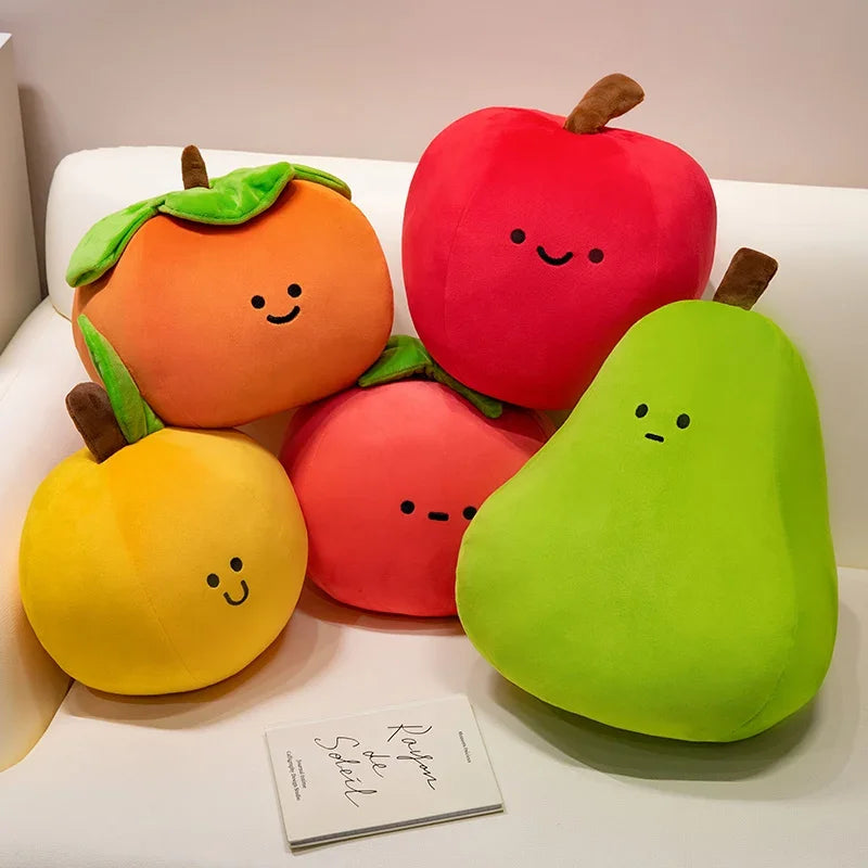 Set of plush kawaii fruit toys including an orange, apple, and pear on a white surface.