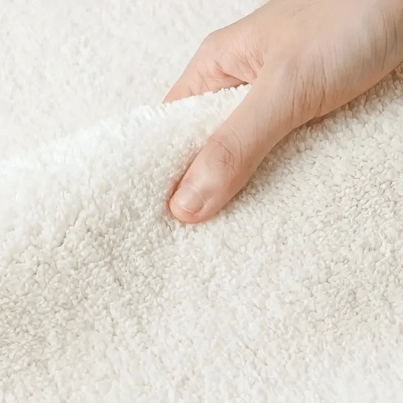 Hand touching a textured white kawaii rug