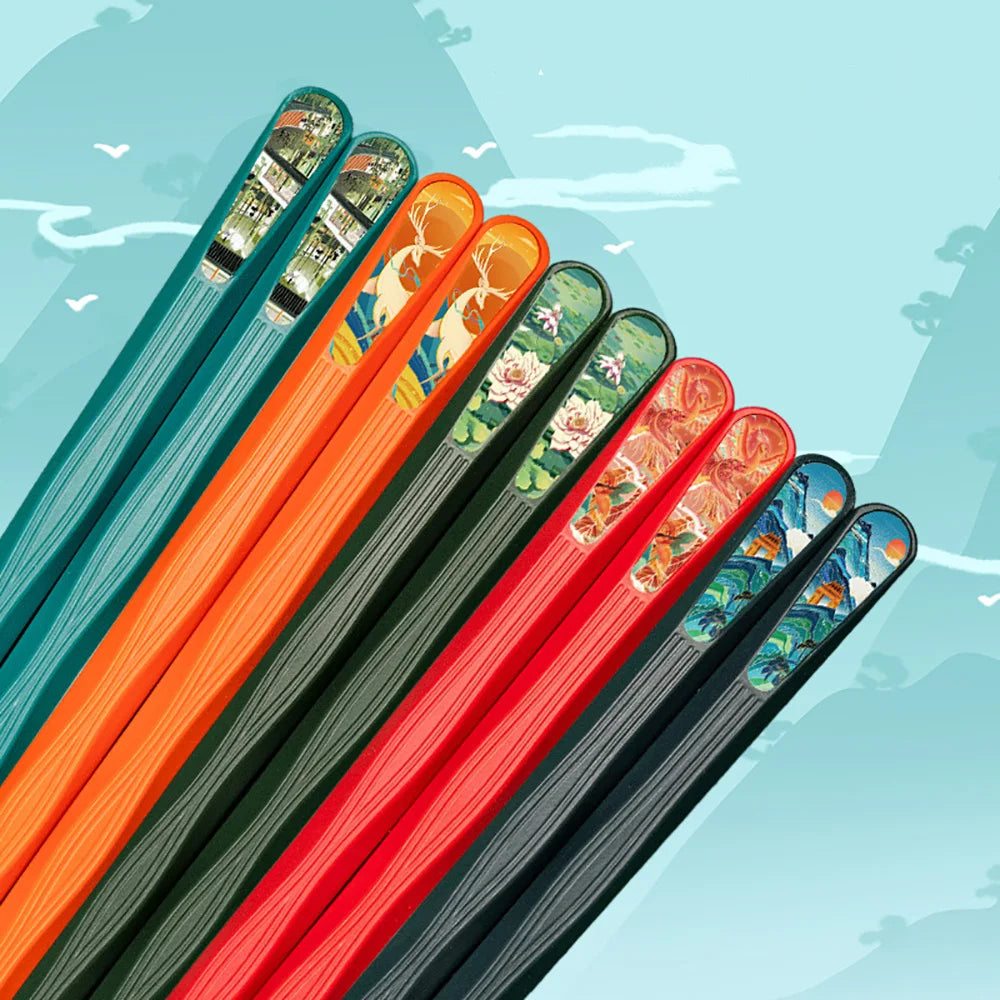 Set of kawaii colorful chopsticks with decorative handles on a light blue background