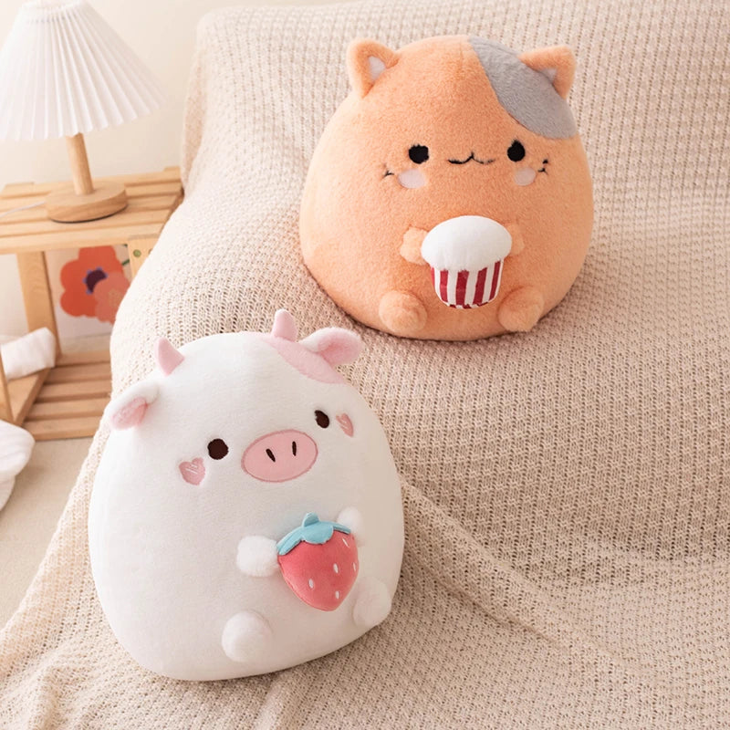 Two kawaii plush toys, one white with pink accents and the other peach with a gray tuft of hair, sitting on a beige surface.