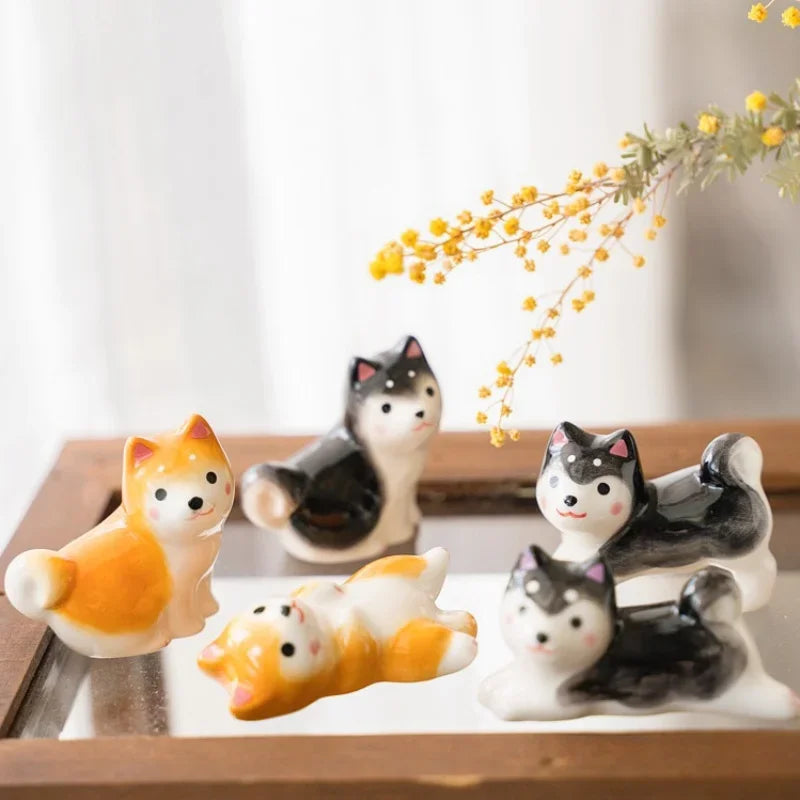 Set of small kawaii animal figurines on a wooden surface with a blurred background