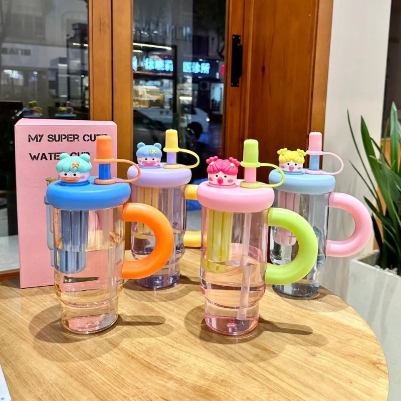 Kawaii colorful children's water bottles with cartoon character lids on a wooden table.