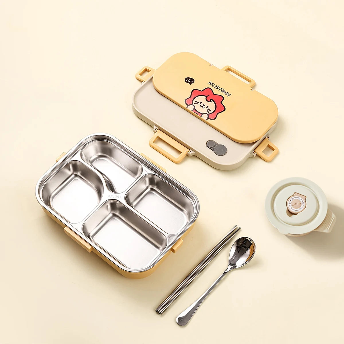 Kawaii bento box with compartments, spoon, and lid on a beige background