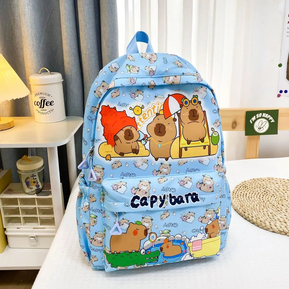 Backpack with Kawaii cartoon capybara design on a bed
