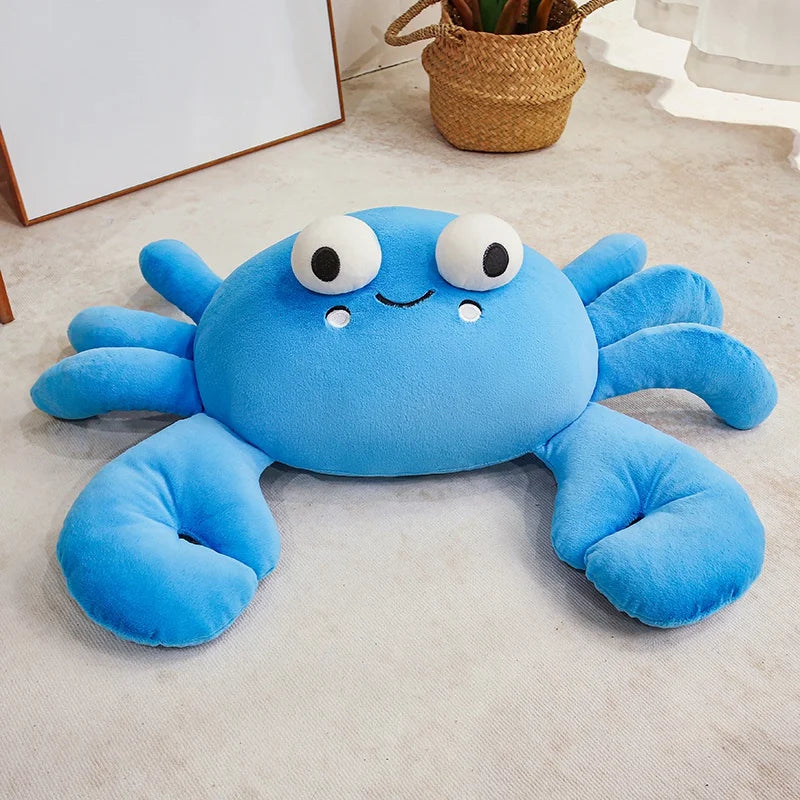 Blue crab-shaped kawaii plush toy on a light-colored floor.